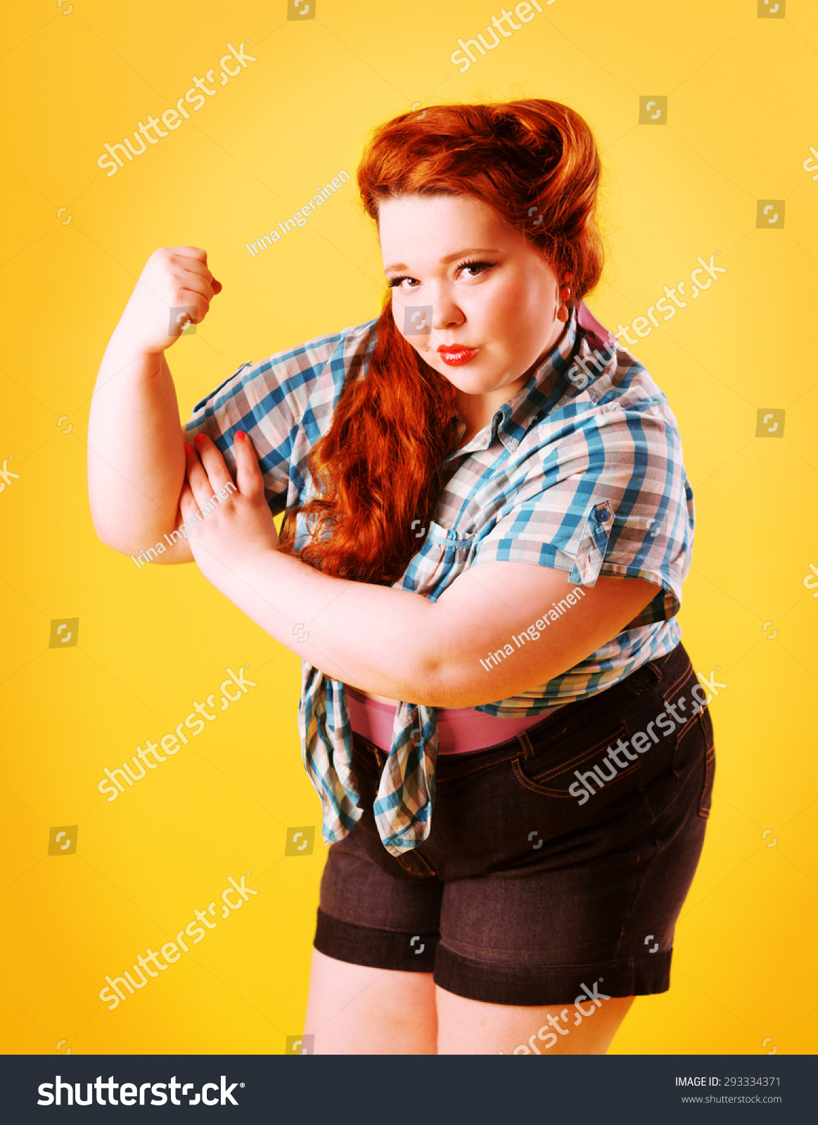 Red head fat pinup girl clenched her first